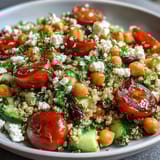 Freshly prepared High Protein Quinoa & Chickpea Salad tossed with lemon herb dressing and ready for lunch.