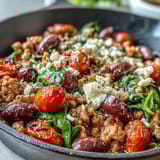 Colorful Mediterranean Keto Ground Chicken Skillet topped with green spinach and feta, served hot and ready to enjoy for a healthy low-carb weeknight dinner.
