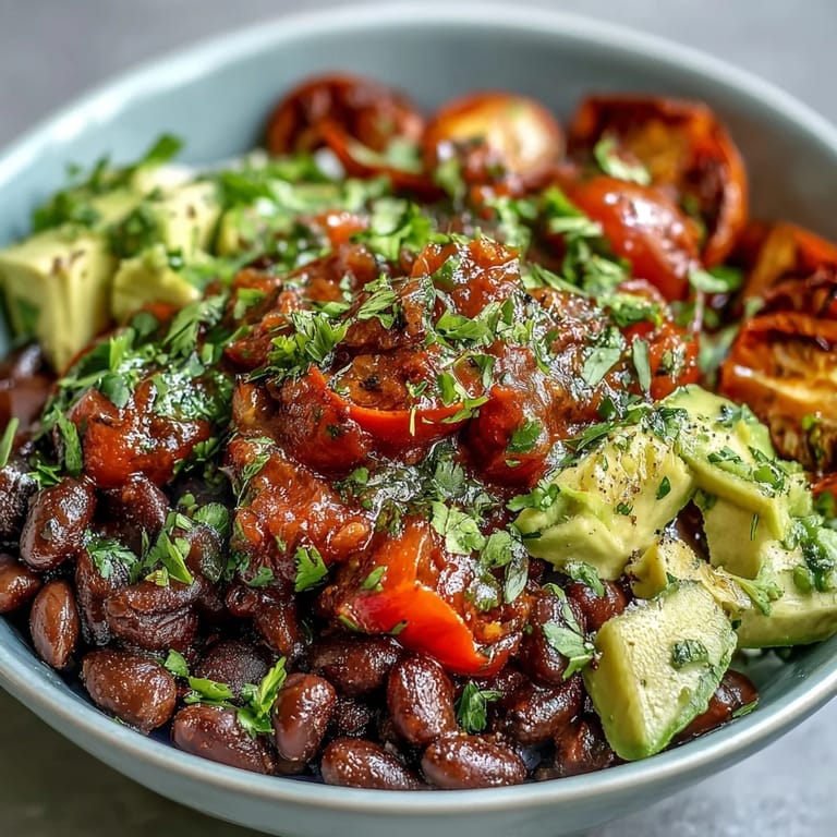 Delicious Plant-Based Taco Bowl, piled high with colorful veggies and seasoned beans.