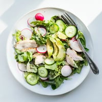 Fresh grilled chicken slices rest atop vibrant mixed greens, crisp cucumber, and peppery radish in Spring Detox Chicken Salad.